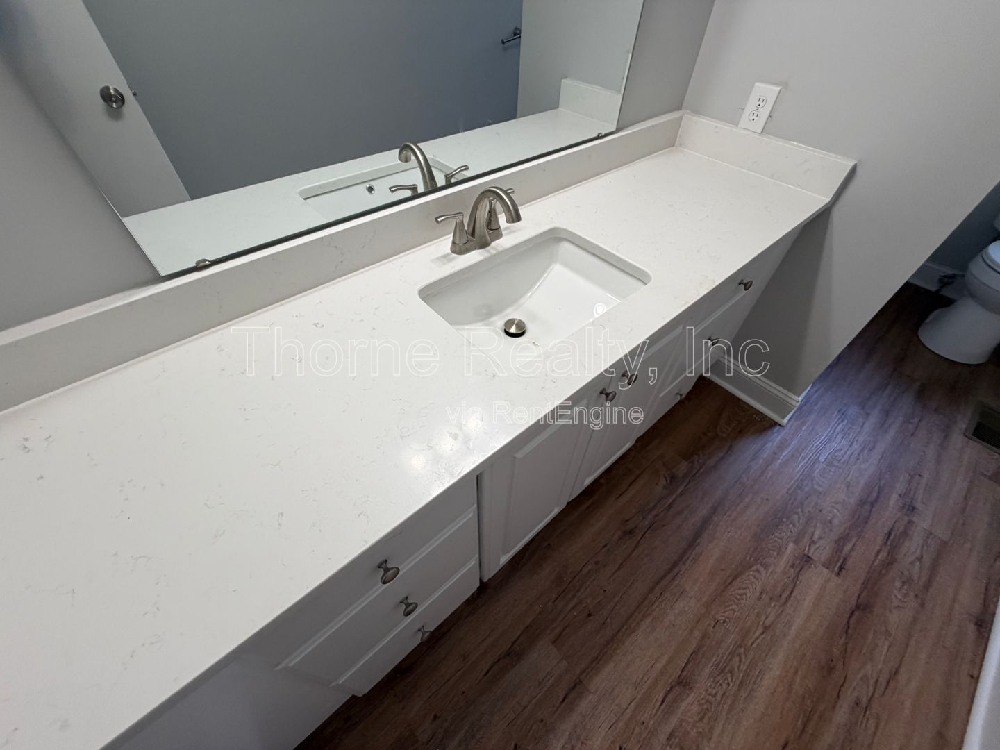 Large renovation  just completed - Brick ranch on corner lot with double car garage property image